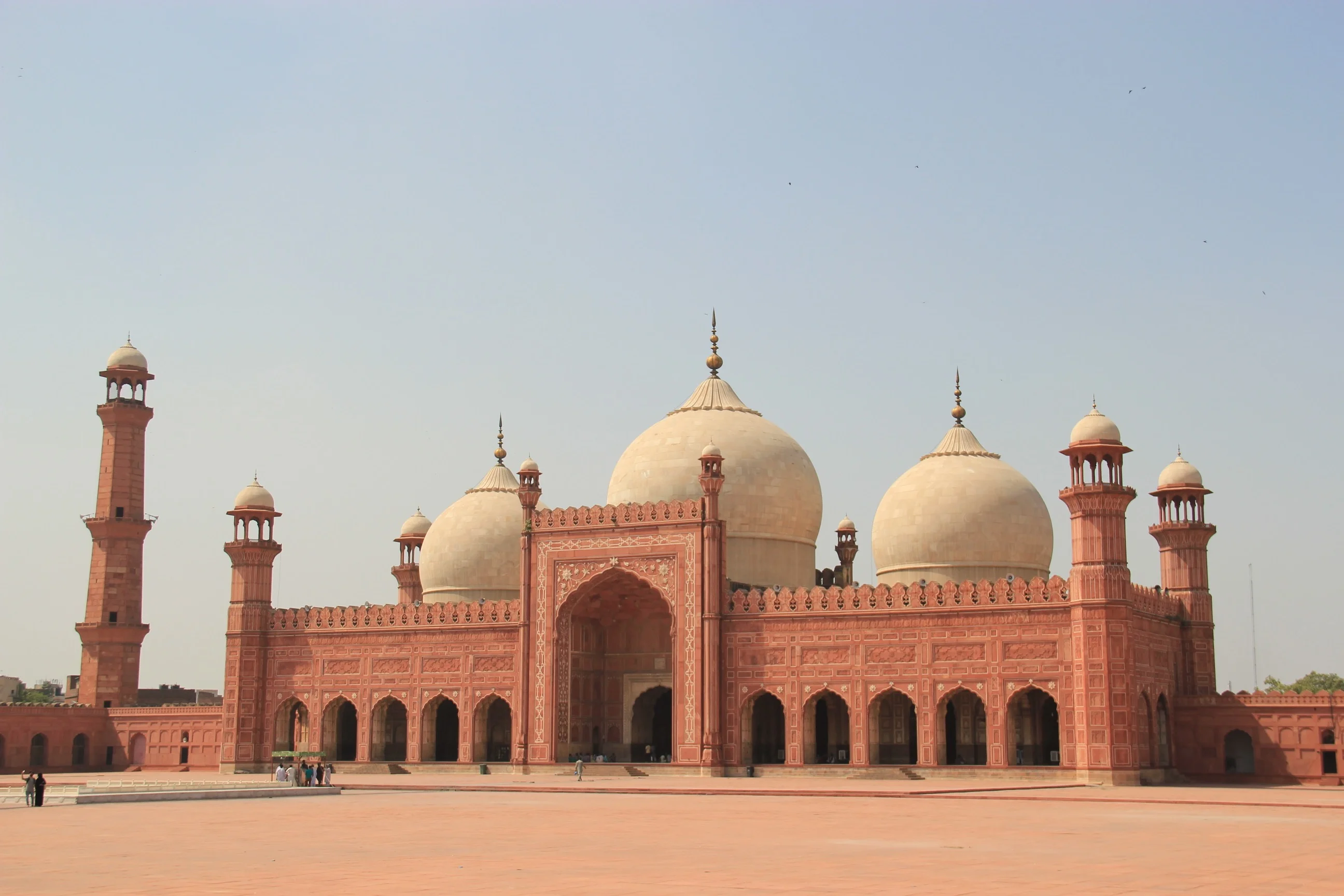 A scenic depiction of the punjabi-culture Fort of Pakistan, highlighting its impressive architecture against a backdrop of rolling hills.